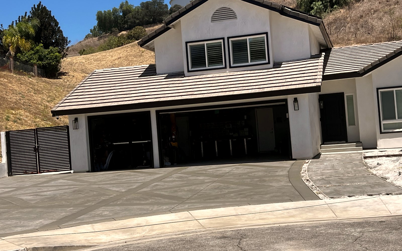 Finished diamond-scored concrete driveway at the same hillside home