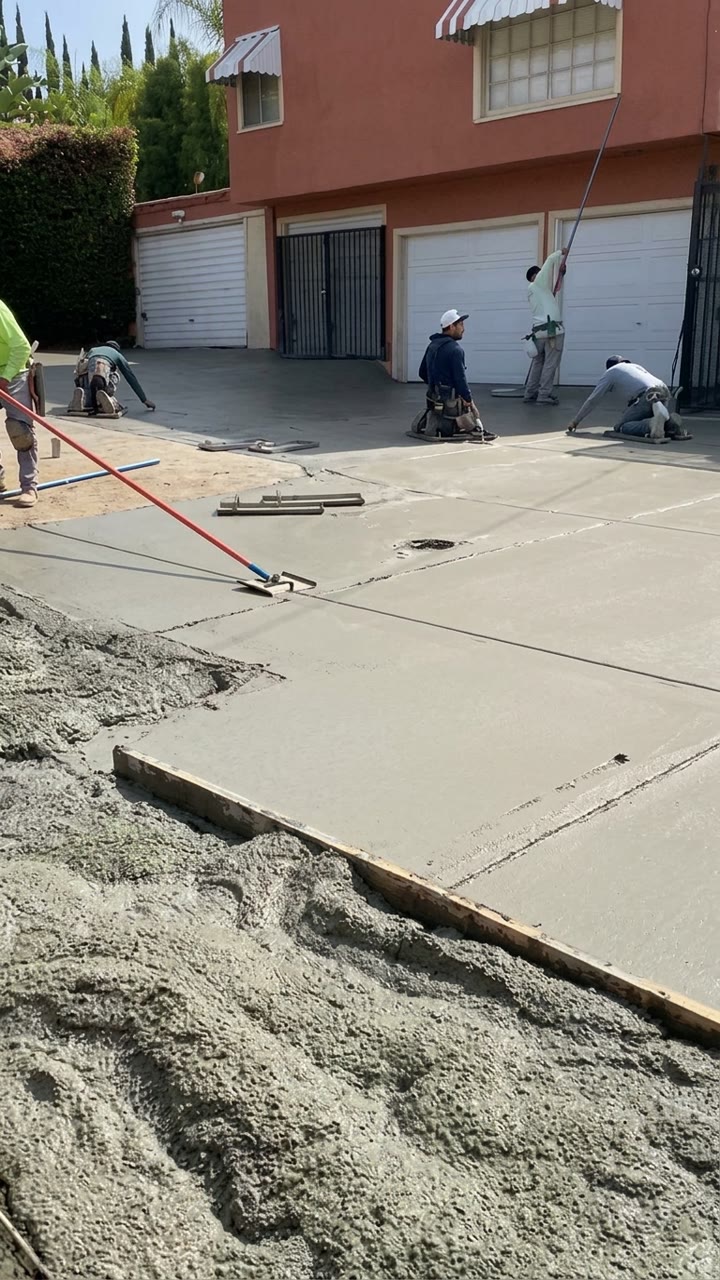 Level Line crew pouring and finishing a concrete driveway