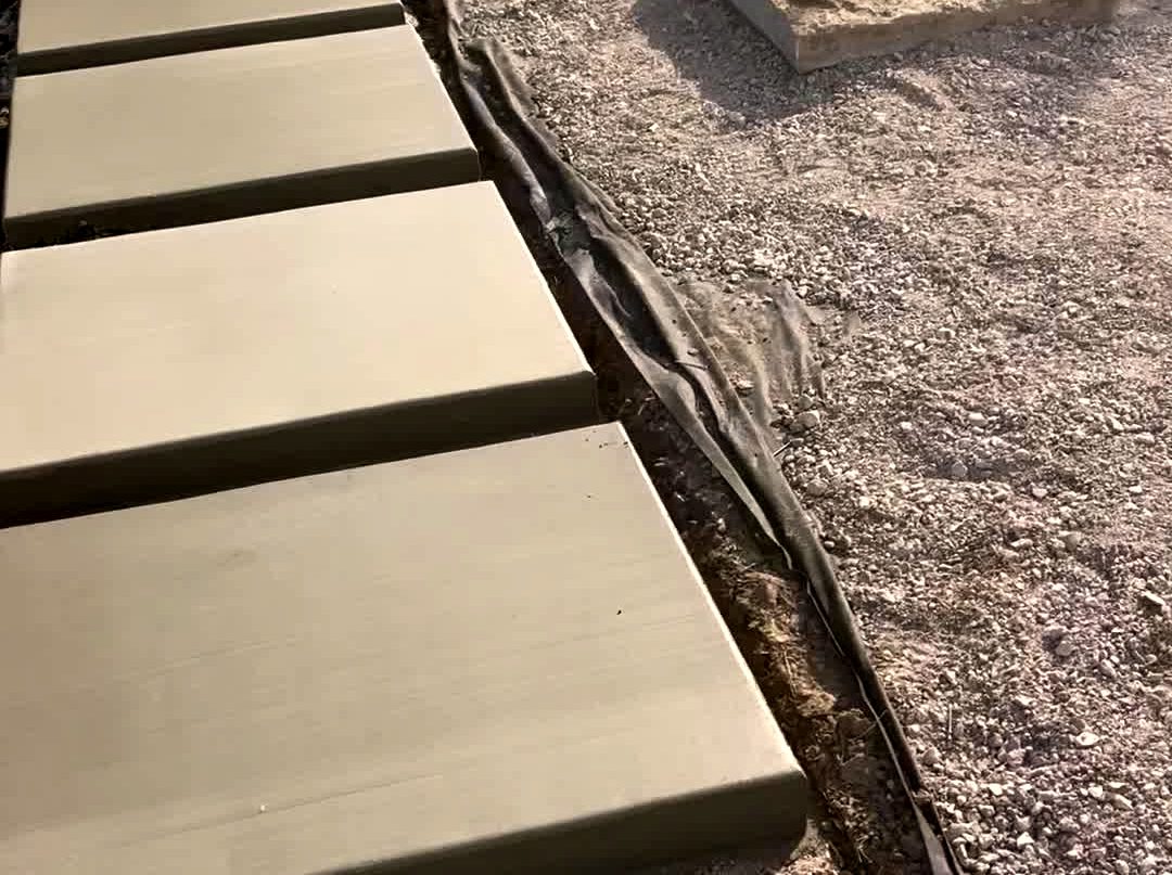 Floating concrete step walkway with a set utility cover, just finished